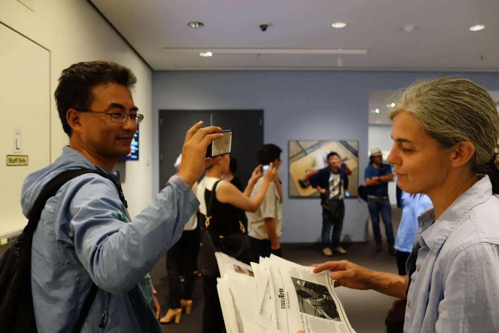 Pema Tseden (left) taking a picture of MTSP Director Lauran Hartley (right)